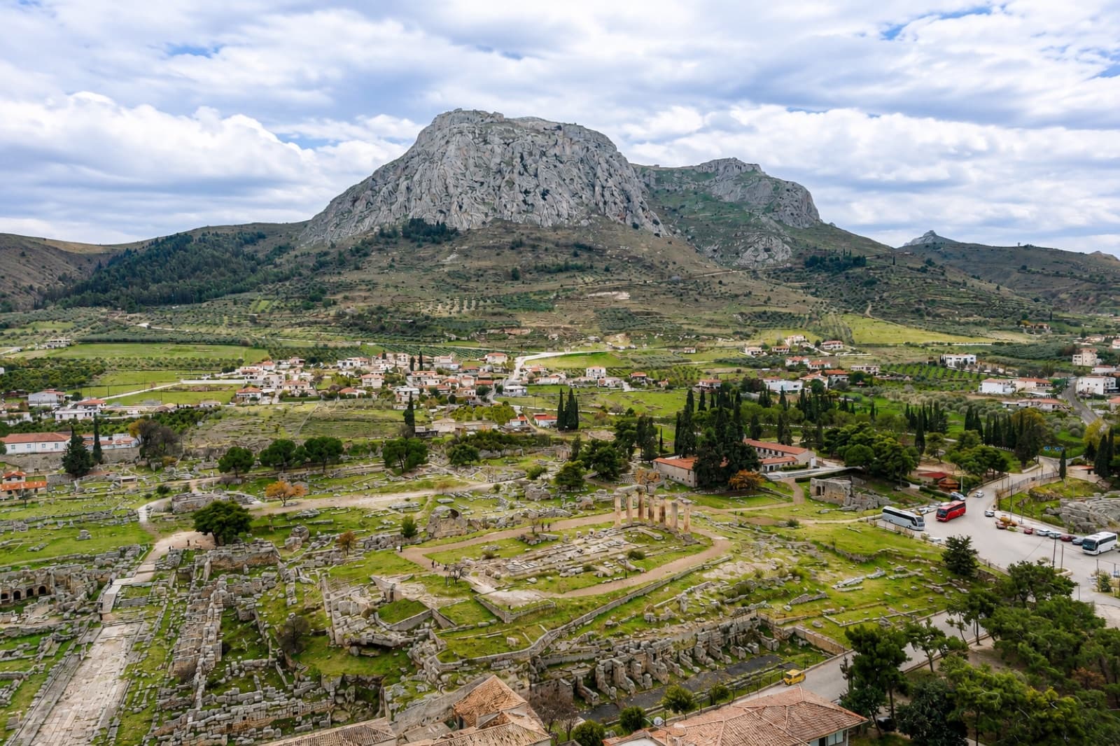 The archaeological site of Ancient Corinth below the Acrocorinth rock